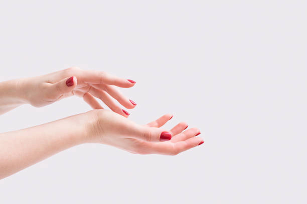 istock Women's hands. Spa manicure on a gray background. 1307750195