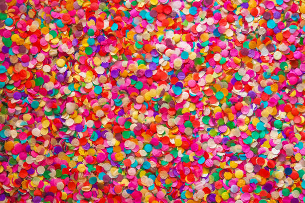 istock Confetti background, basis for a festive design or a postcard. Carnival, abstract wedding or birthday backdrop. Colored circles from paper 1307751830