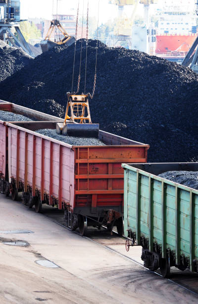 istock argo port, loading coal into railway freight wagons, railroad. Cargo terminal, cranes. Industrial background. Seaport 1307752702