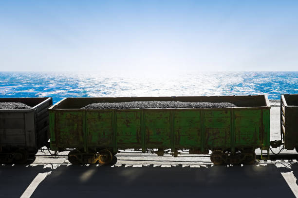 A beautiful landscape photo of a single train car on railroad tracks taken in the Central Illinois countryside on a bright Spring day.
