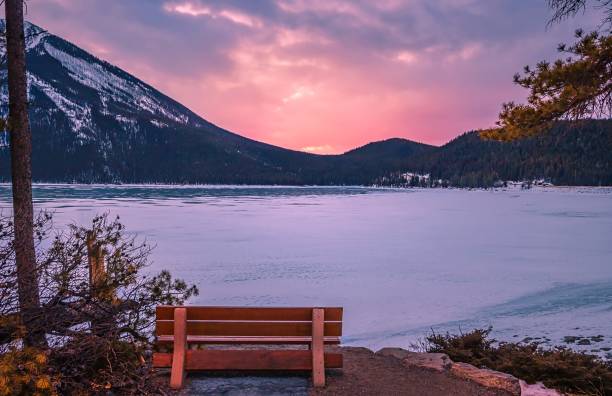 istock Snowy Lake Minnewanka Under A Sunrise Sky 1307753683