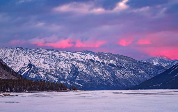 istock Snowy Lake Minnewanka Under A Sunrise Sky 1307753705