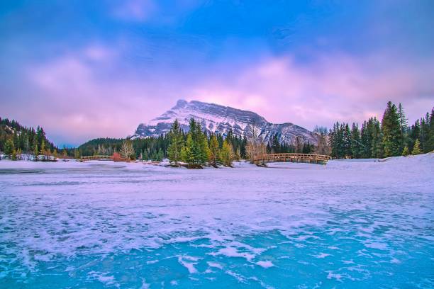 istock Cloudy Sky Over Frozen Cascade Ponds 1307753742