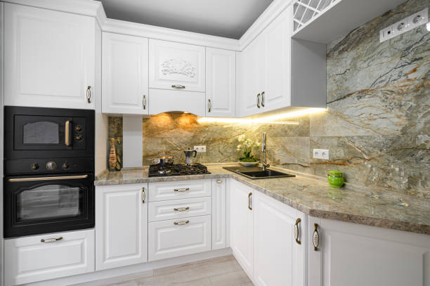 istock Modern classic white kitchen interior with wooden furniture 1307755346