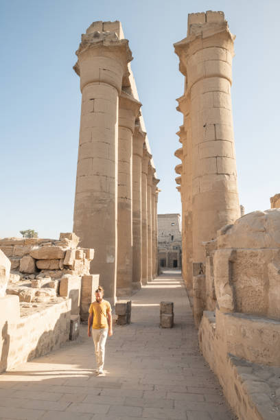 istock Man wonders inside Luxor temple 1307755780