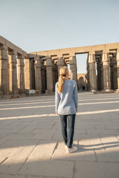 istock Woman explores ancient temples in Egypt 1307755903