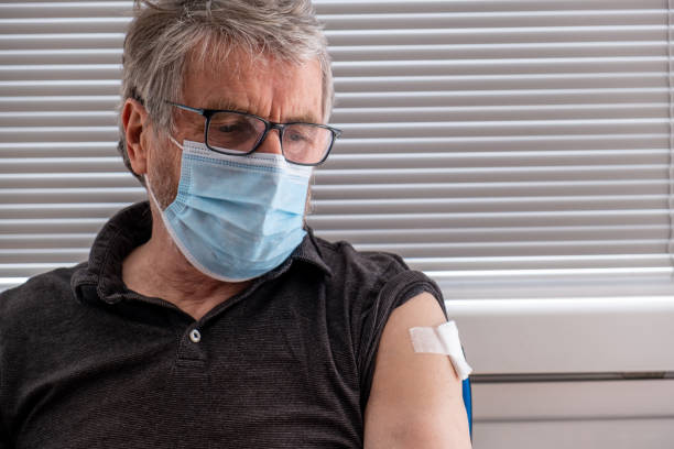 istock Worried senior man who had just been vaccinated portrait 1307755928