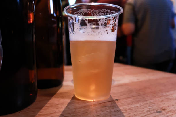 istock Draft beer.  Enjoying Evening Drinks at the pub party in a nightclub . 1307757179