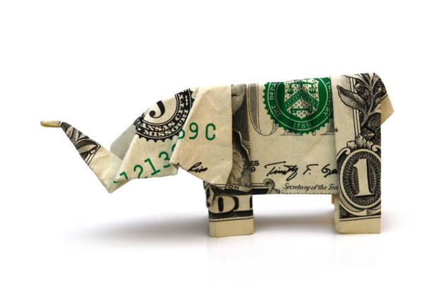 istock Origami dollar elephant on white 1307760191