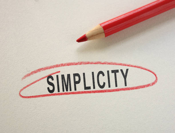 istock Simplicity text circled in red pencil on paper 1307760235