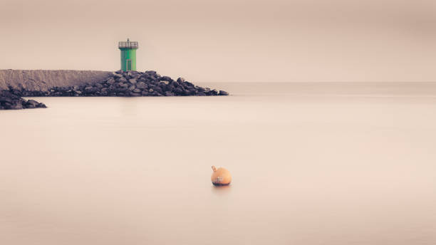 istock minimal light house sea view 1307760523