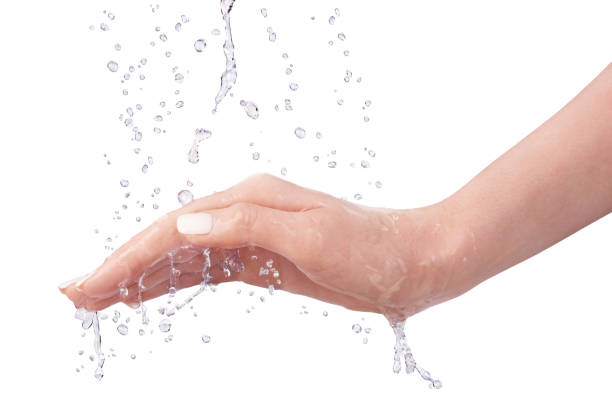 Hand as water protection. Water falling on the hand on a white background