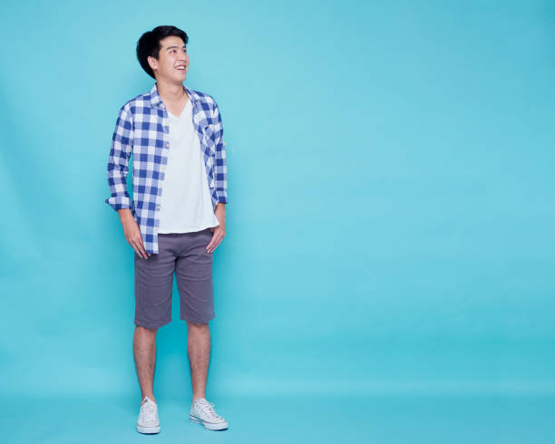 istock Asian handsome man posing on blue background. 1307761637