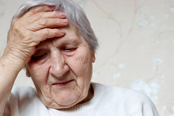 istock Elderly woman put her hand on forehead 1307763485