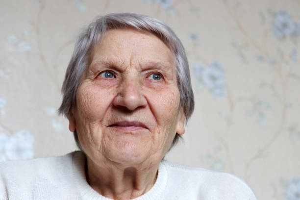 istock Elderly woman with peaceful expression thought about something 1307763585