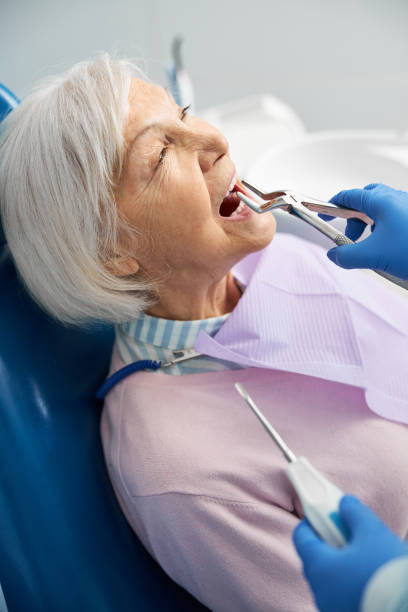 istock Doctor is removing upper tooth with forceps 1307764414