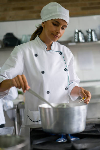 istock Chef cooking in a commercial kitchen 1307764417
