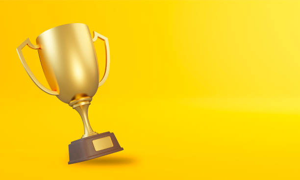 coppa trofeo su sfondo giallo - pedestal football award concepts foto e immagini stock