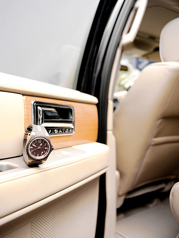 Luxury watch in a luxury car