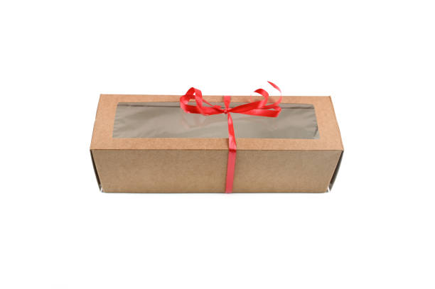 istock Craft packaging with a red bow, on an isolated background 1307768722