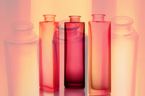 Three original, colored, frosted glass bottles.