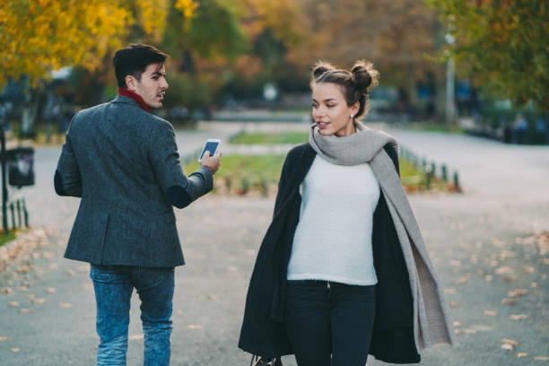 Man losing mind on seeing an attractive woman Young man staring beautiful woman in the city park staring stock pictures, royalty-free photos & images