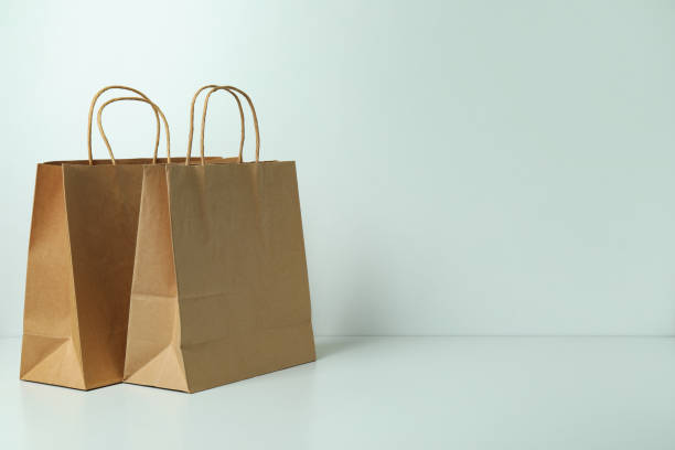 istock Blank paper bags on white background, space for text 1307769819
