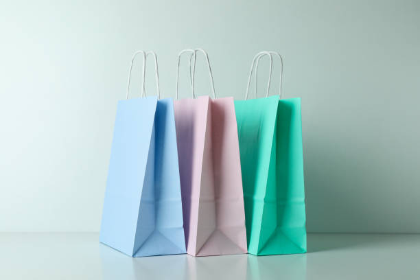 istock Blank colorful paper bags on white background 1307770052