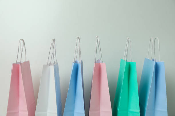 istock Blank colorful paper bags on white background 1307770078