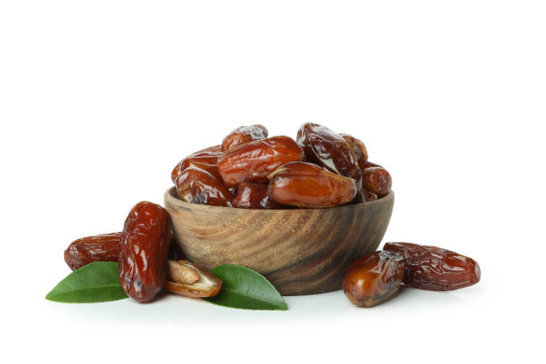 istock Bowl with dried dates isolated on white background 1307770150