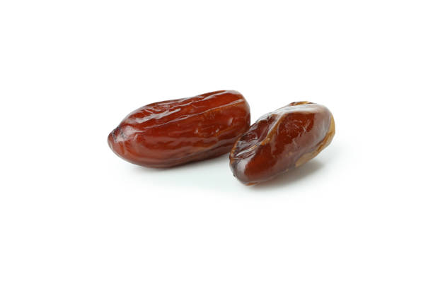 istock Tasty dried dates isolated on white background 1307770964