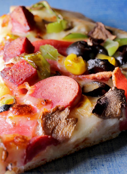 istock slice of pizza on a table 1307771788