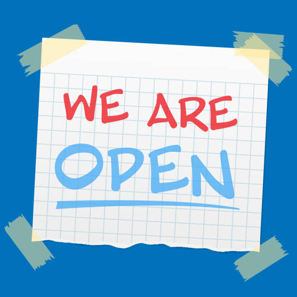 istock text WE ARE OPEN written on torn piece of quad-ruled paper 1307772501