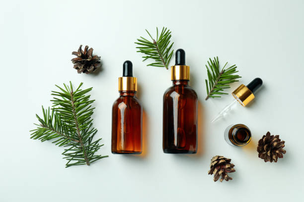 istock Flat lay with pine oil on white background 1307772682