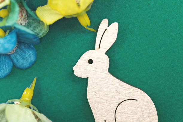 istock Wooden Easter bunny, festive background with decoration 1307772702