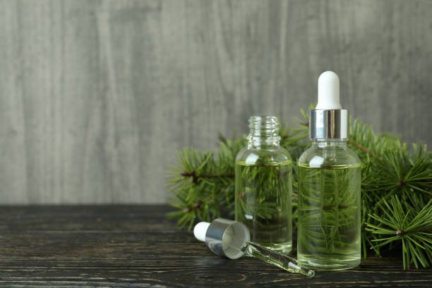 istock Aromatherapy concept with pine oil on wooden table 1307772832