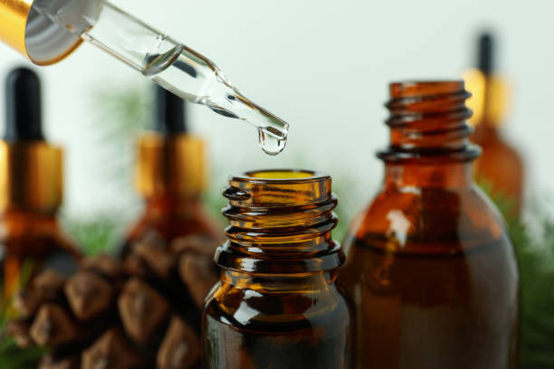 istock Pipette and bottles with pine oil, close up 1307772894