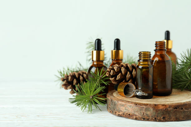 istock Aromatherapy concept with pine oil on white wooden table 1307773141