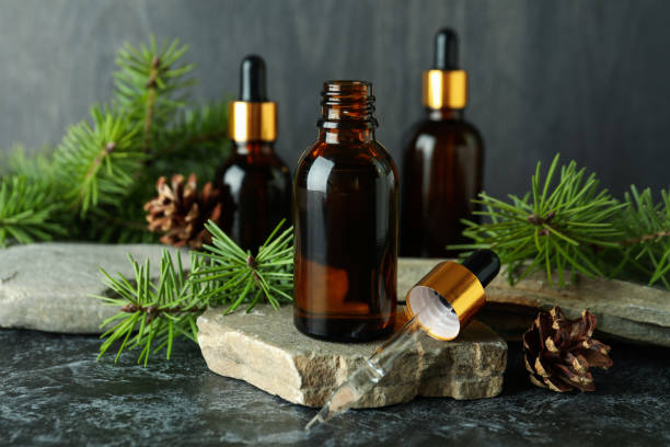 istock Aromatherapy concept with pine oil on black smoky table 1307773151