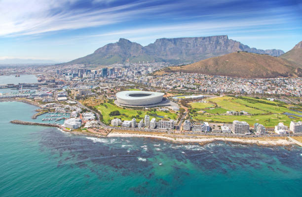 Aerial photo of Cape Town Stadium and CBD with Table Mountain in the background Cape Town, Western Cape / South Africa - 10/26/2020: Aerial photo of Cape Town Stadium and CBD with Table Mountain in the background cape peninsula photos stock pictures, royalty-free photos & images