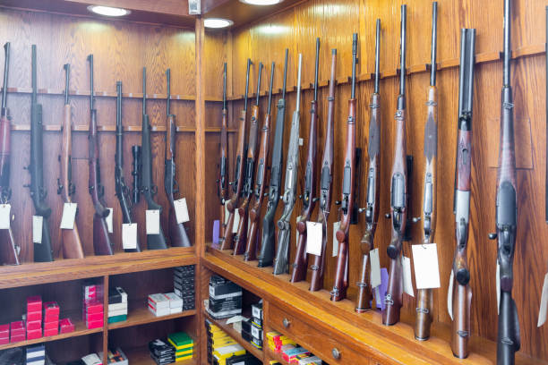 istock Display stand with hunting and sporting rifles in gun shop 1307774207