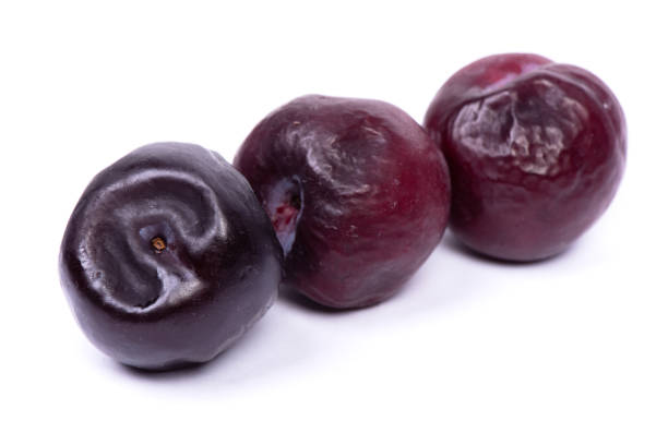 istock Group of overreipe plums 1307776626