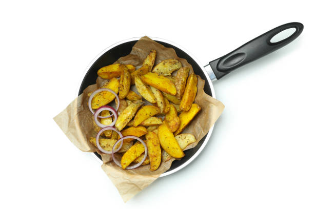 istock Pan with fried potato wedges isolated on white background 1307777830