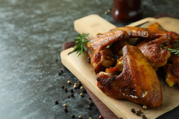 istock Board with baked chicken wings, space for text 1307779279