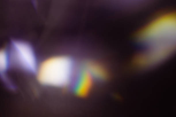 istock colorful warm rainbow light leaks on black background with dust texture 1307779425