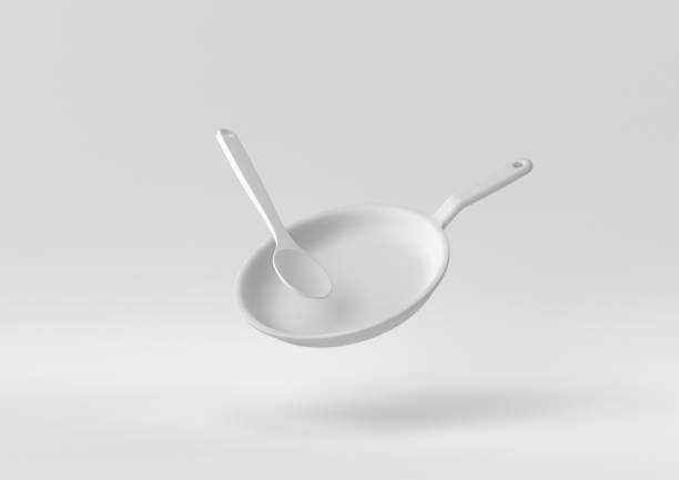 istock White Flying pan floating in white background. minimal concept idea creative. monochrome. 3D render. 1307779518