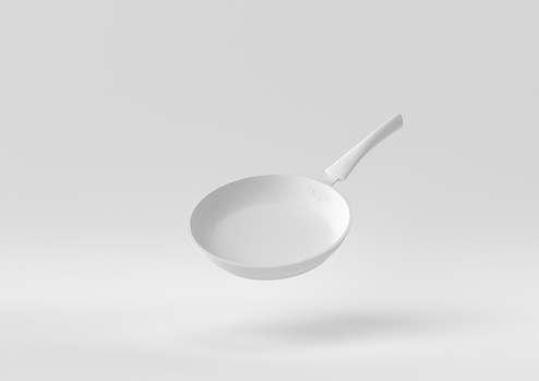 White Flying pan floating in white background. minimal concept idea creative. monochrome. 3D render.
