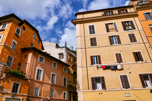 The facades of some ancient residential buildings near Campo de Fiori square, in the medieval and baroque heart of Rome. Campo de Fiori is one of the most loved and visited areas by tourists from all over the world, characterized by the presence of noble palaces, countless churches and hidden treasures of Baroque art. Image in high definition format