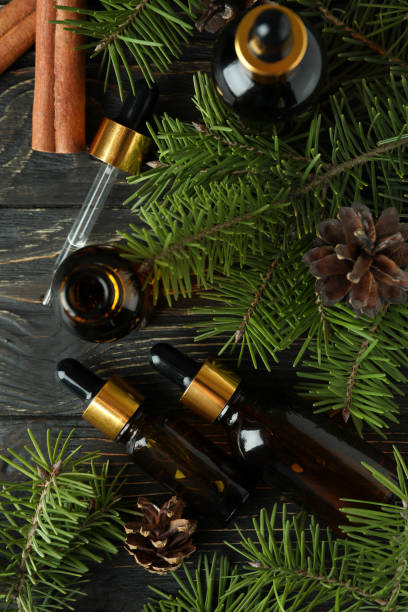 istock Aromatherapy concept with pine oil on wooden table 1307780939