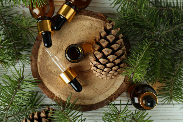 istock Aromatherapy concept with pine oil on white wooden table 1307781167
